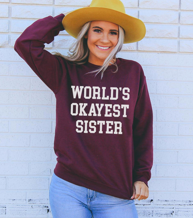 Image of Worlds Okayest Sister Sweatshirt 1558593601 from Edmene LLC